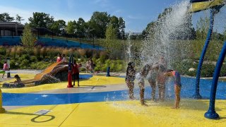 People cooling off at a splashpad