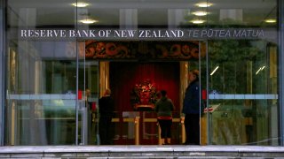 A security guard stands in the main entrance to the Reserve Bank of New Zealand located in central Wellington, New Zealand, July 3, 2017.