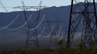 Power lines and transmission towers near the Ivanpah Solar Electric Generating System in the Mojave Desert in San Bernardino County, California, U.S., on Saturday, Feb. 19. 2022.