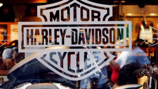 Motorcycle maker Harley Davidson’s logo appears on the window of a store in Boston, Massachusetts.