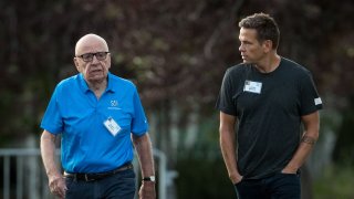 (L to R) Rupert Murdoch, executive chairman of News Corp and chairman of Fox News, and Lachlan Murdoch, co-chairman of 21st Century Fox, walk together as they arrive on the third day of the annual Allen & Company Sun Valley Conference, July 13, 2017 in Sun Valley, Idaho.