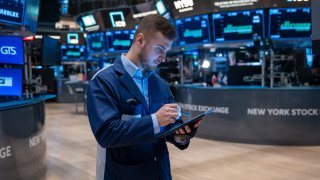 Traders work on the floor of the New York Stock Exchange (NYSE) on July 22, 2024 in New York City.