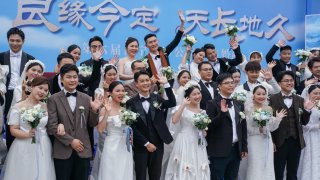 Newly-wed couples attending a group wedding ahead of ‘520 I Love You’ Day on May 19, 2024 in Nanning, Guangxi Zhuang Autonomous Region of China.