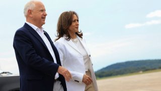 U.S. Vice President and Democratic presidential candidate Kamala Harris and her running mate Minnesota Governor Tim Walz walk as they prepare to depart at Chippewa Airport in Eau Claire, Wisconsin, U.S., August 7, 2024. 