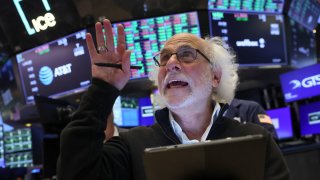 Traders work on the floor at the New York Stock Exchange (NYSE) in New York City, U.S., August 8, 2024.