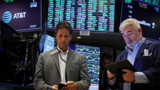 Traders work on the floor at the New York Stock Exchange on Aug. 8, 2024.