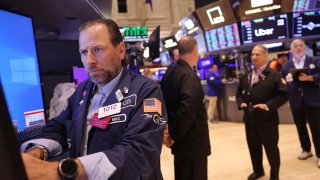 Traders work on the floor of the New York Stock Exchange during morning trading on August 12, 2024 in New York City. 