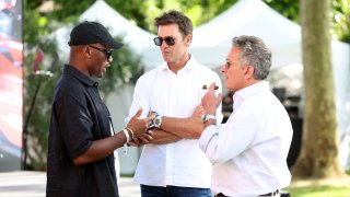 Team owners Didier Drogba and Tom Brady speak with Alejandro Agag, co-founder and chairman of the E1 Series, ahead of the E1 race in Venice, Italy — the second of the series.