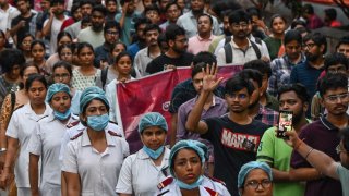 Medical professionals and students participate in a silent march as they condemn the rape and murder of a doctor, in Kolkata on August 15, 2024. 