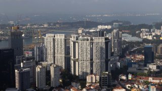 The Pinnacle@Duxton, a Housing & Development Board (HDB) public housing estate, center, in Singapore, on Monday, Feb. 19, 2024. 