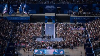 Athletes celebrate at the Champions Park