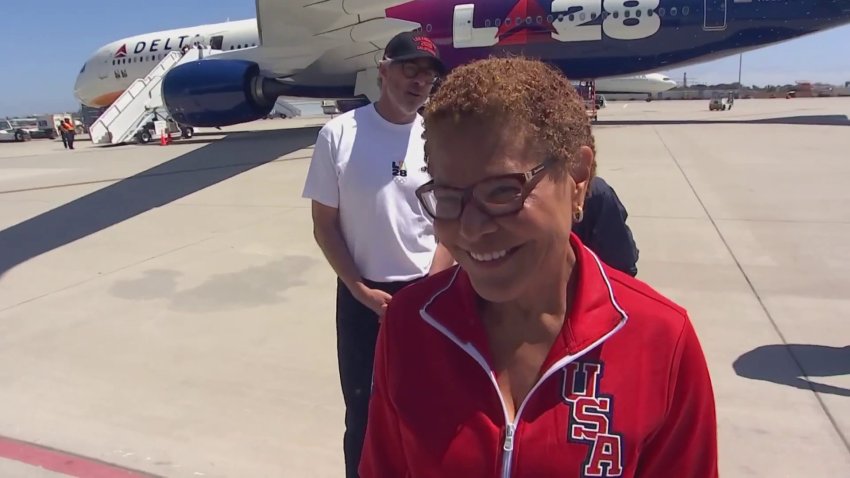 ‘We have the flag now. It's on us': LA mayor arrives at LAX with Olympic flag