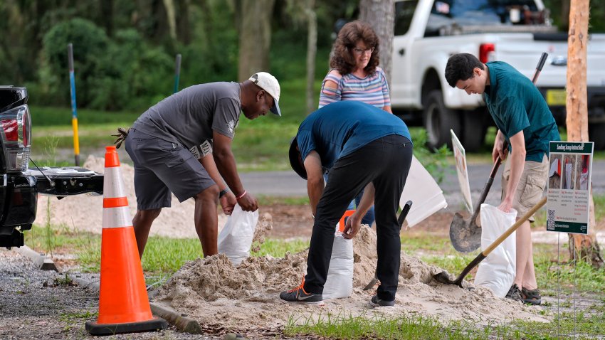 Residents fill sand bags at the Edward Medard Conservation Park