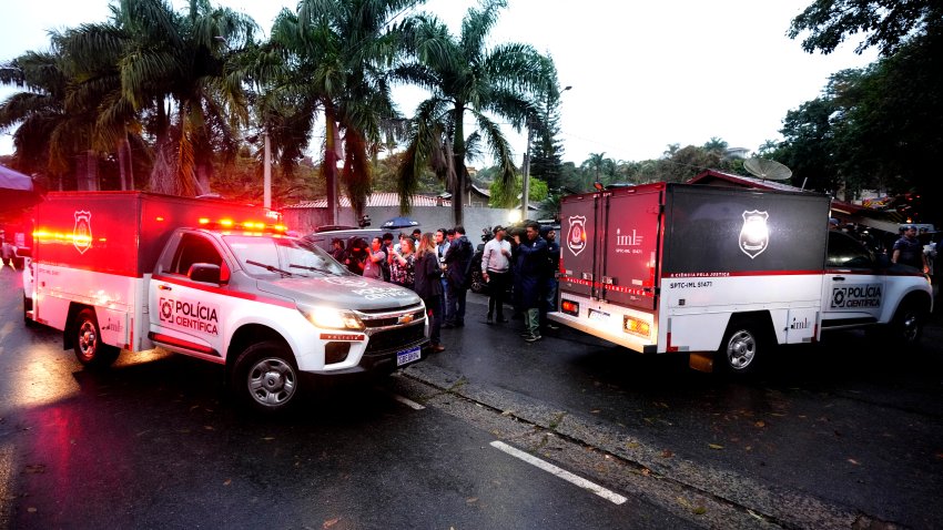 Police vehicles used to carry bodies leave at the gated community where a plane crashed in Vinhedo, Sao Paulo state, Brazil, Saturday, Aug. 10, 2024.