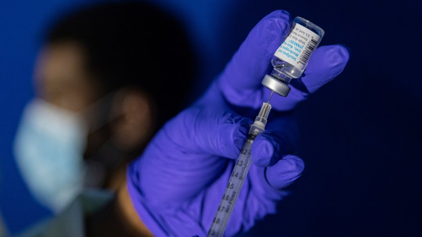 FILE – Family nurse practitioner Carol Ramsubhag-Carela prepares a syringe with the Mpox vaccine before inoculating a patient at a vaccinations site on, Aug. 30, 2022, in the Brooklyn borough of New York.