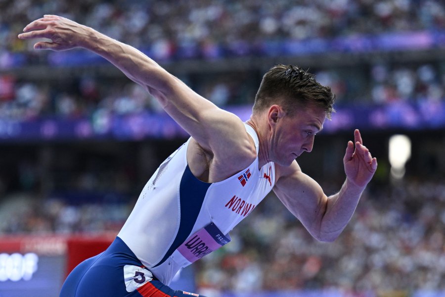 Norway's Karsten Warholm takes the start in the men's 400m hurdles heat of the athletics event at the Paris 2024 Olympic Games at Stade de France in Saint-Denis, north of Paris, on August 5, 2024