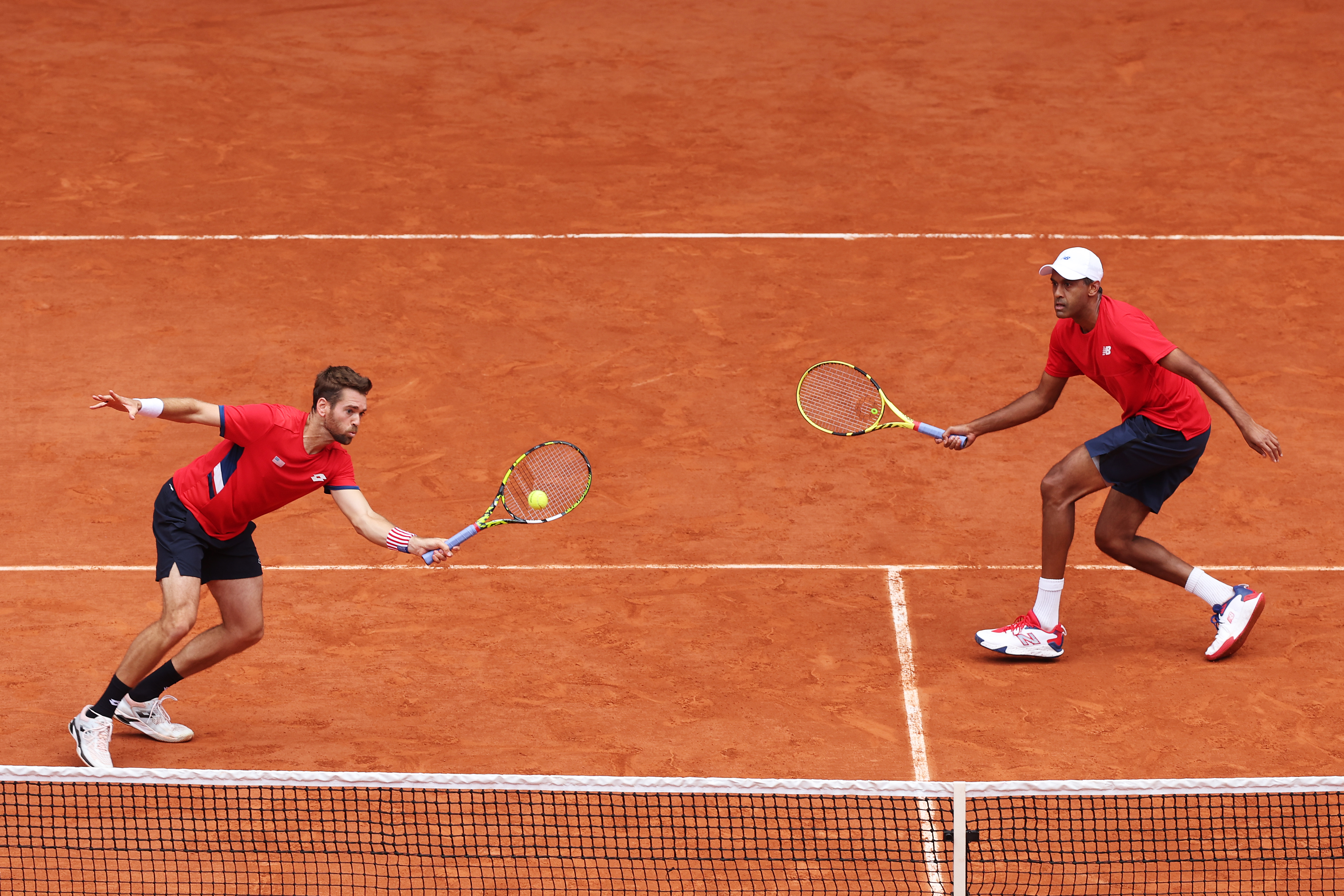 Austin Krajicek of Team United States plays a forehand as he plays with Rajeev Ram