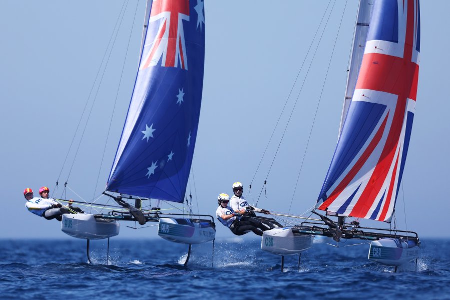 Rhiannan Brown and Brin Liddell of Australia and Anna Burnet and John Gimson of Team Great Britain compete in the Multihull Nacra class on day eleven of the Olympic Games Paris 2024 at Marseille Marina on August 06, 2024 in Marseille, France