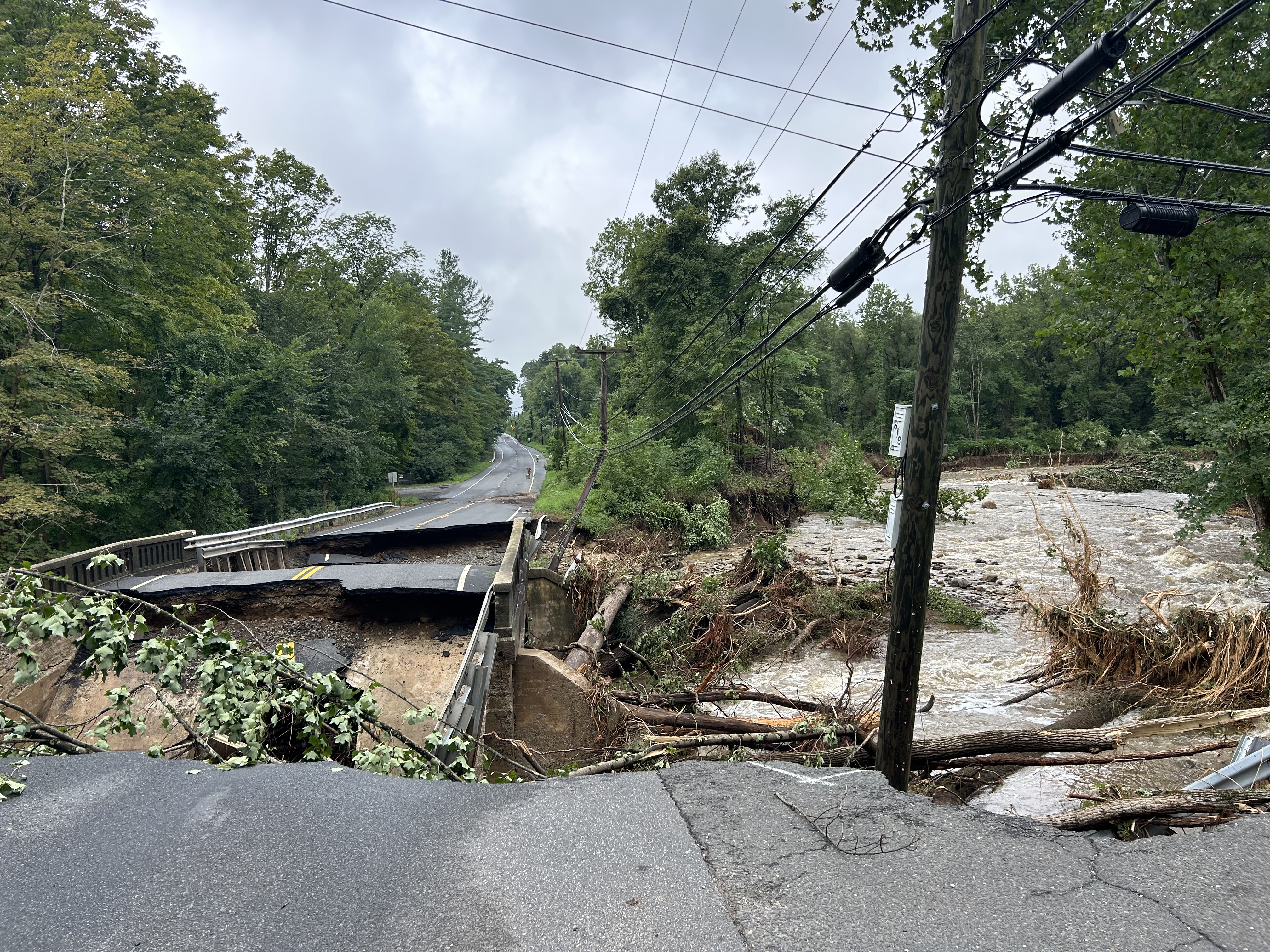 Photos: Heavy rain causes flooding, knocks out roads and bridges