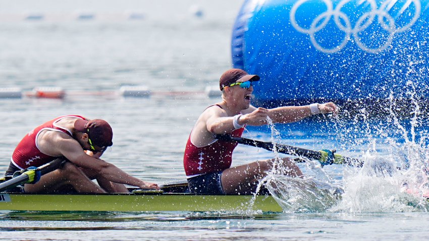 Aug 2, 2024; Vaires-sur-Marne, France; Romoan Roeoesli (SUI) and Andrin Gulich (SUI) celebrate after winning bronze in men’s pair rowing during the Paris 2024 Olympic Summer Games at Vaires-sur-Marne Nautical Stadium. Mandatory Credit: Sarah Phipps-USA TODAY Sports