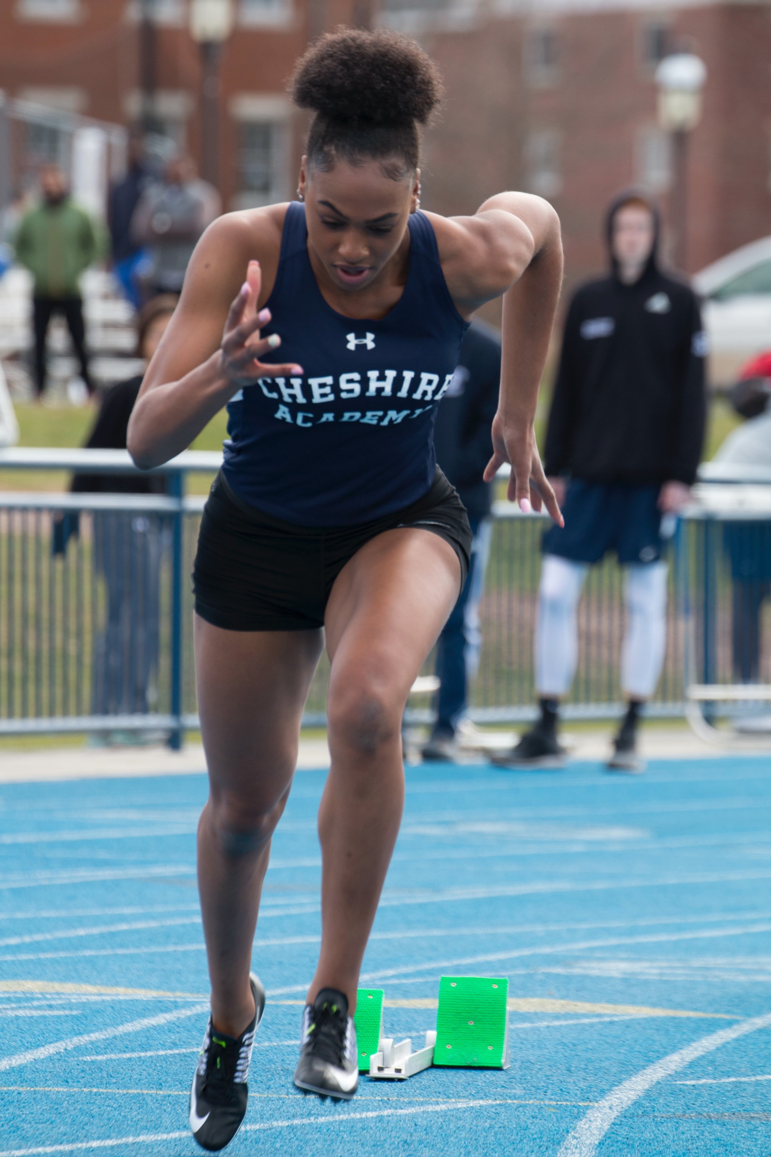 Alexis Holmes running for Cheshire Academy as a high school student.