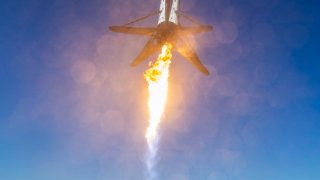 The booster of SpaceX’s Falcon 9 rocket lands on the company’s barge after launching the Spaceflight SSO-A mission.