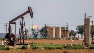 An oil pump jack is shown in a field in Stanton, Texas, on June 27, 2024.