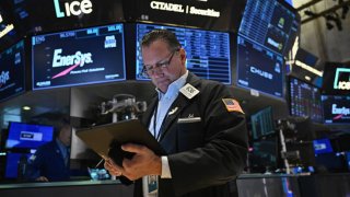 Traders work on the floor of the New York Stock Exchange (NYSE) during morning trading in New York on August 23, 2024. 