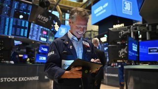 Traders work on the floor of the New York Stock Exchange (NYSE) during morning trading in New York on August 23, 2024.