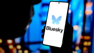 The Bluesky logo displayed on a smartphone screen. 