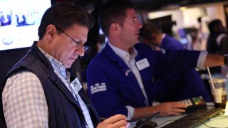 Traders work on the floor of the New York Stock Exchange during morning trading on September 04, 2024 in New York City. 