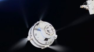 In this image from video provided by NASA, the unmanned Boeing Starliner capsule fires its thrusters as it pulls away from the International Space Station on Friday, Sept. 6, 2024.