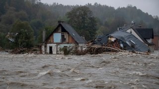 Properties are damaged as floodwaters rise following heavy rain on September 15, 2024 in Jesenik, Czech Republic.