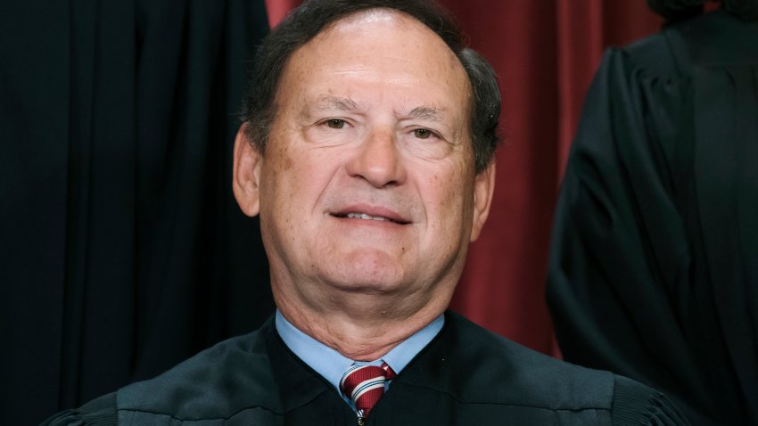 FILE – Associate Justice Samuel Alito joins other members of the Supreme Court as they pose for a new group portrait, Oct. 7, 2022, at the Supreme Court building in Washington. Alito rejects calls to step aside from Supreme Court cases on Trump and Jan. 6.