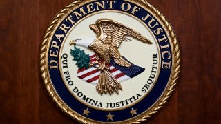 The seal of the Department of Justice