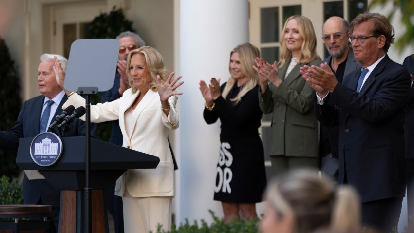 First lady Jill Biden, with actors Martin Sheen, left, Aaron Sorkin, right, and other members of the cast of The West Wing, is applauded as she hosts an event on the Rose Garden at the White House to mark the 25th anniversary of the television series, The West Wing, Friday, Sept. 20, 2024, in Washington.