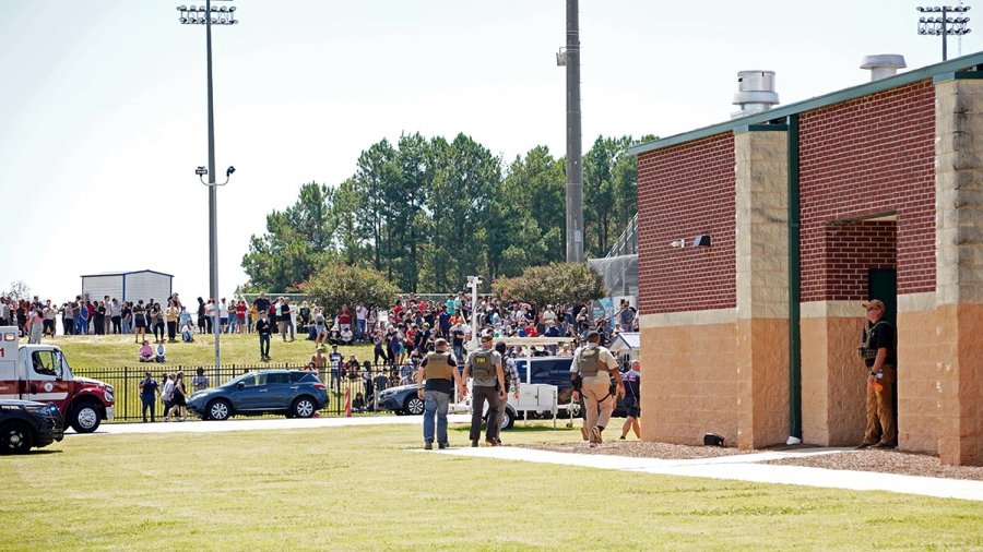 Students wait to be picked up by their parents after a shooting at Apalachee High School in Georgia.