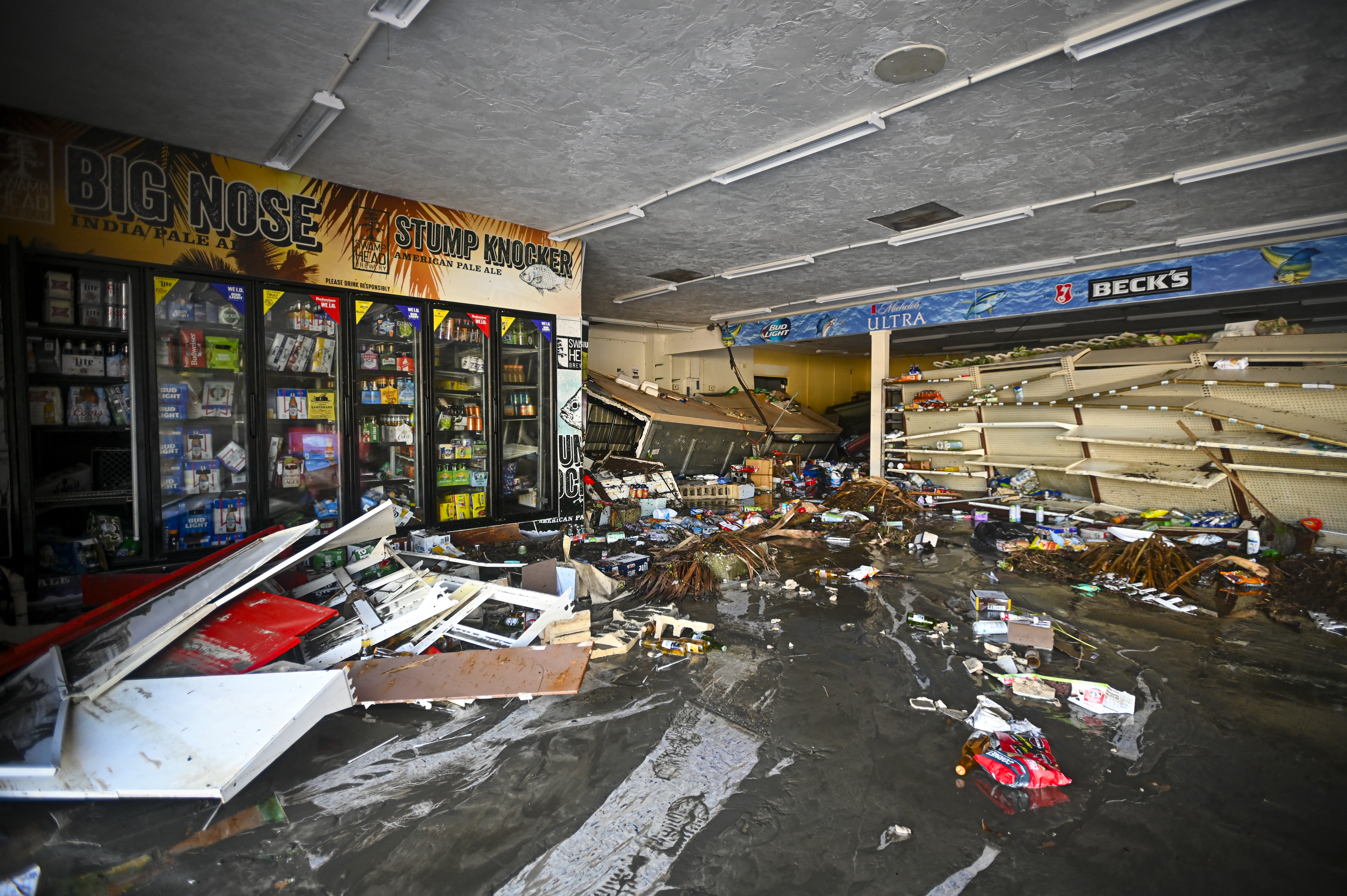 Debris are left inside a flooded store after Hurricane Helene made landfall in Cedar Key, Florida, on September 27, 2024.