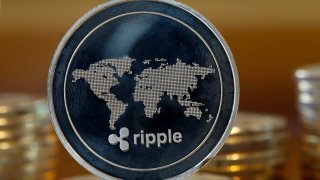 In this photo illustration, a visual representation of the digital Cryptocurrency Ripple is displayed on January 30, 2018 in Paris, France. 