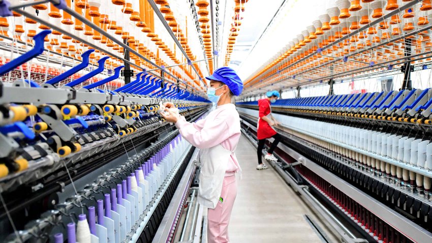 A textile factory on December 30, 2022 in Jiangxi Province. Chinese manufacturing activity contracted at its sharpest pace in nearly 3 years in December.