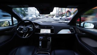 A Waymo autonomous self-driving Jaguar taxi drives along a street on March 14, 2024 in Los Angeles, California. 