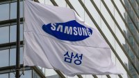 A Samsung Group flag flutters in front of the company’s Seocho building in Seoul. 