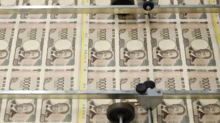 Sheets of newly-designed Japanese 10,000 yen banknotes move through a machine at the National Printing Bureau Tokyo plant in Tokyo, Japan, on Wednesday, June 19, 2024. Persistent weakness in the yen is raising concerns about the potential for a resurgence in cost-push inflation, likely weighing on private consumption.