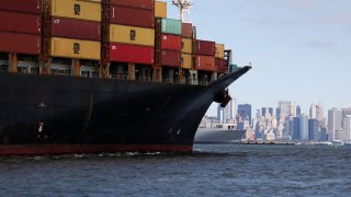 A ship carries shipping containers through Upper Bay in New York, U.S., September 30, 2024.