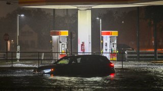 A vehicule is stranded on a water-flooded street after Hurricane Milton made landfall in Brandon, Florida on October 9, 2024. 