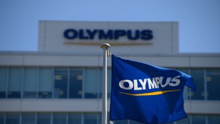 The Olympus Corp. flag flies outside the company’s Ishikawa research development facility in Tokyo, Japan, on Monday, March 14, 2022. 