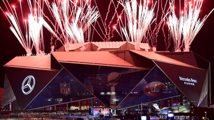 Fireworks shoot in the air above Mercedes-Benz Stadium