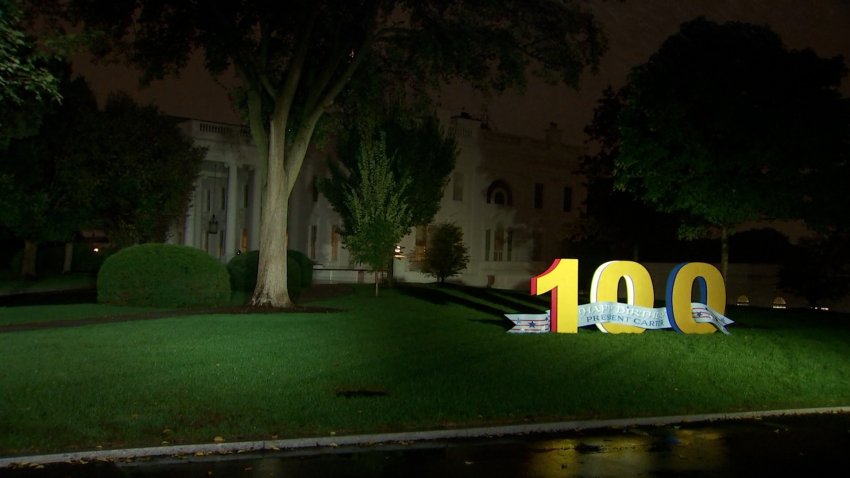 A sign in front of the White House celebrating 100 Year birthday of Jimmy Carter