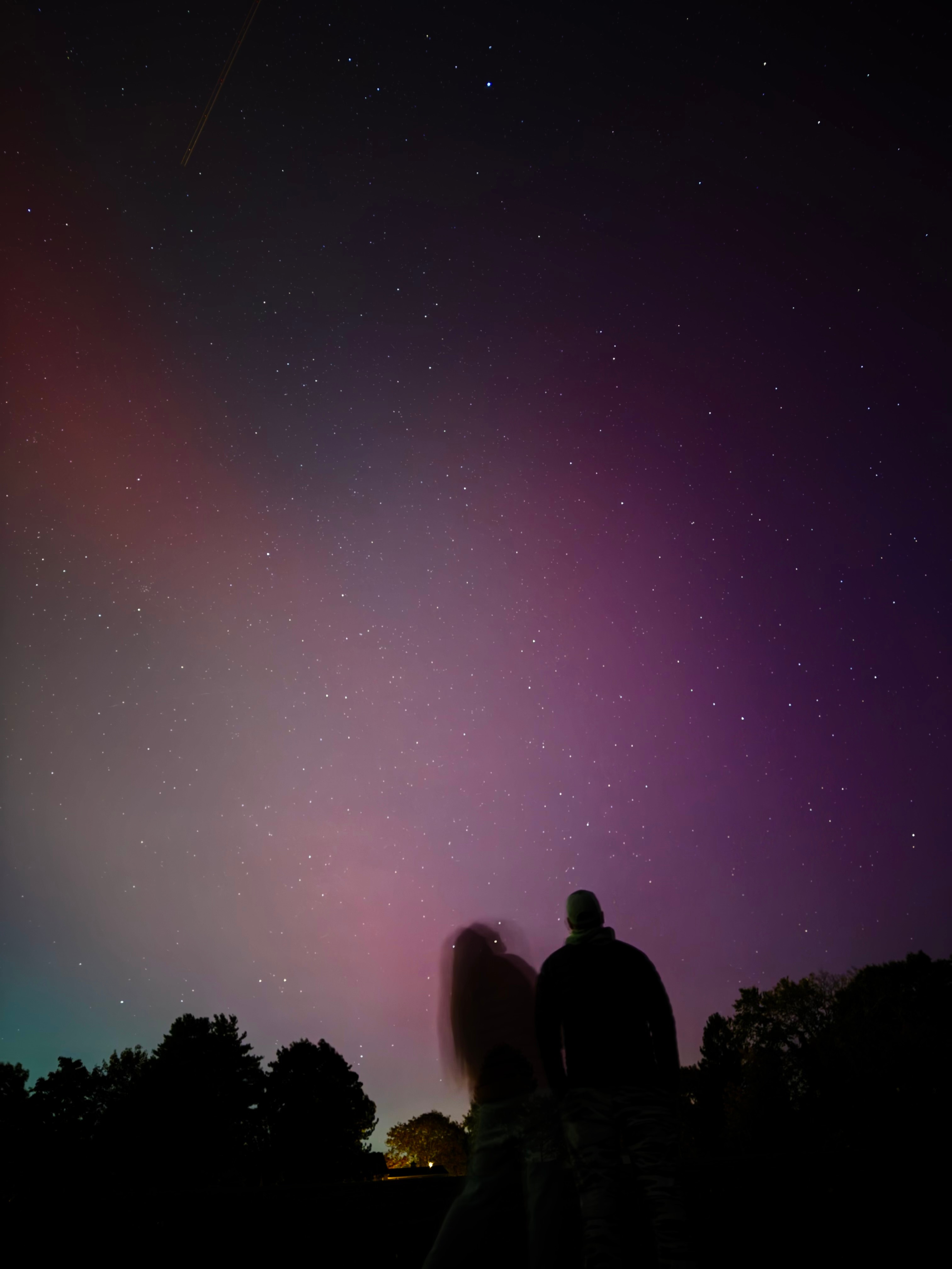 The Northern Lights made a rare and breathtaking appearance over the fields of Taft School, casting brilliant colors across the night sky. My husband, a teacher at the school, and I couldn't resist the opportunity to go out and witness the spectacle first hand. Against the dark, serene backdrop of the campus, the Northern Lights danced in vibrant shades of green and purple, offering a breathtaking glimpse of the magic of nature.