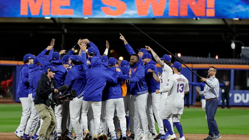 The New York Mets celebrate after defeating the Philadelphia Phillies in Game 4 of the National League baseball playoff series, Wednesday, Oct. 9, 2024, in New York. (AP Photo/Adam Hunger)